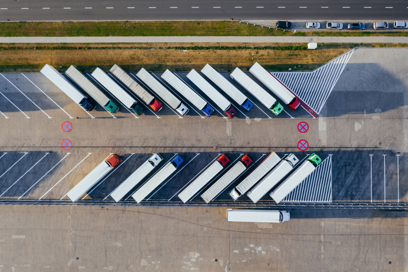 Fleet of commercial trucks at a truck stop